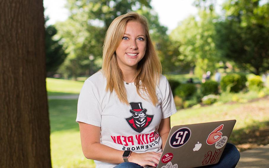 Madison Hobson works on laptop